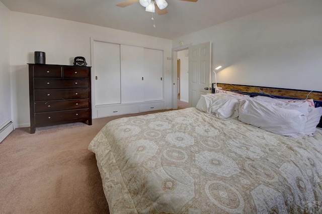 bedroom with light carpet, ceiling fan, and a closet