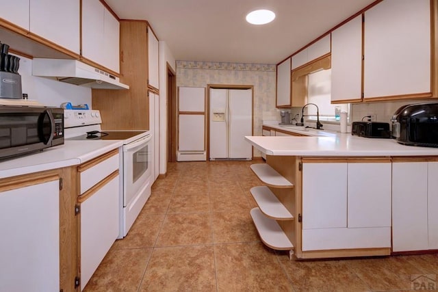 kitchen with open shelves, white appliances, under cabinet range hood, and light countertops