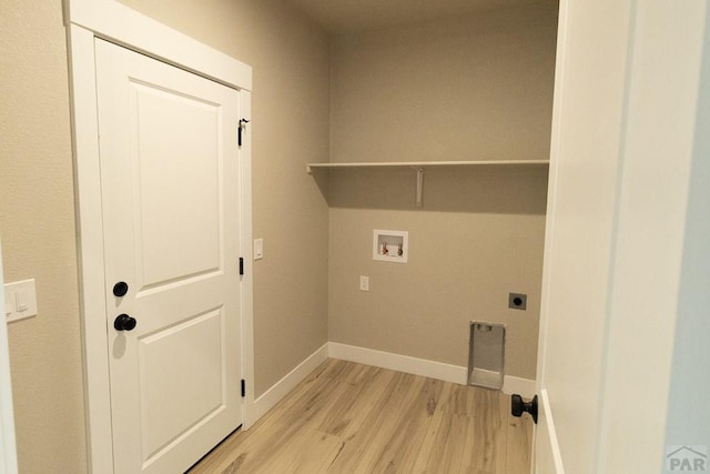 clothes washing area featuring laundry area, light wood finished floors, baseboards, hookup for a washing machine, and electric dryer hookup