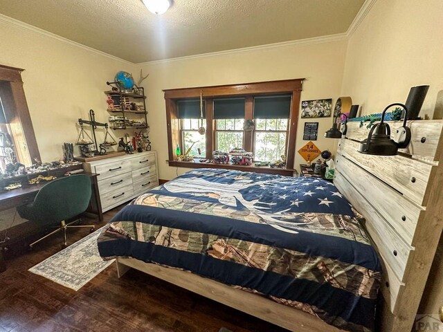 bedroom with crown molding, a textured ceiling, and wood finished floors