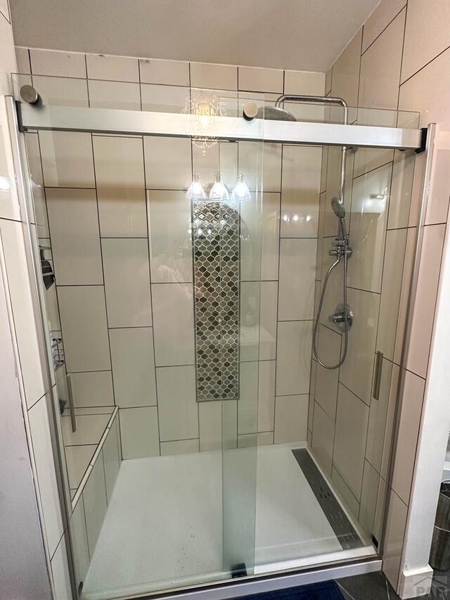 bathroom with a shower stall