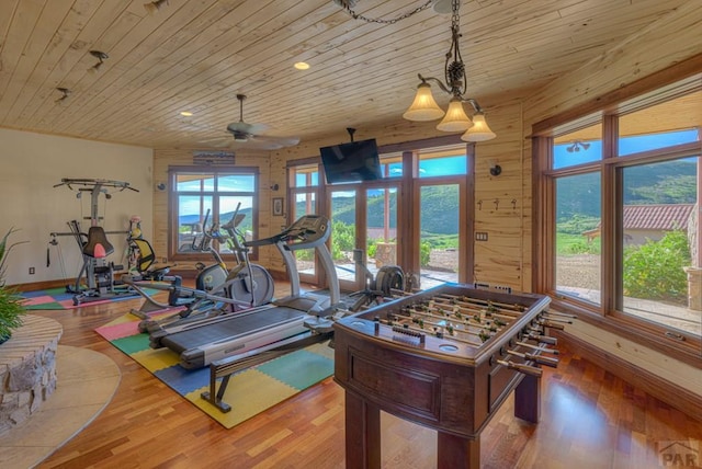 rec room with recessed lighting, wooden ceiling, wood finished floors, and baseboards