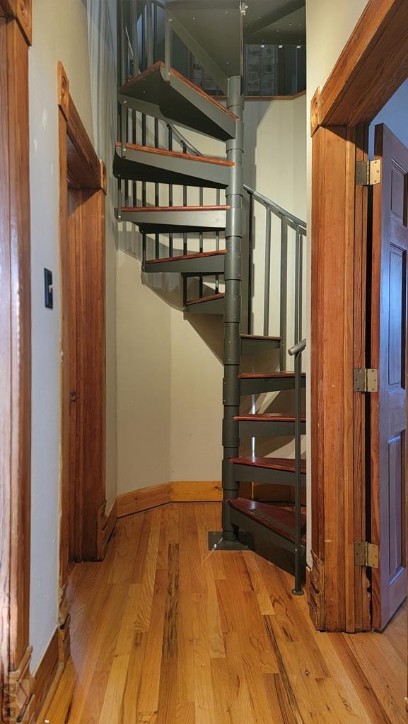 stairs featuring baseboards and wood finished floors