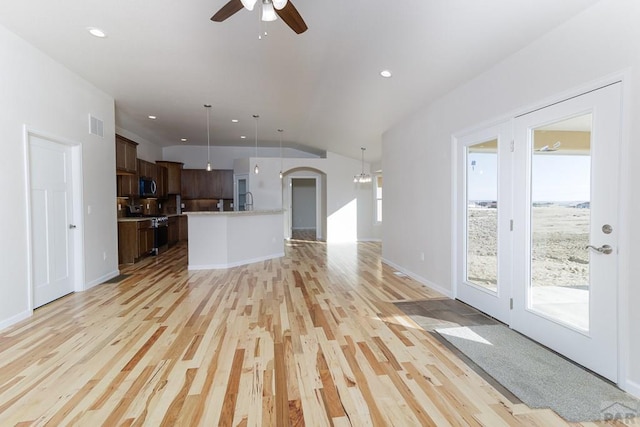 unfurnished living room with lofted ceiling, recessed lighting, visible vents, light wood-style flooring, and ceiling fan