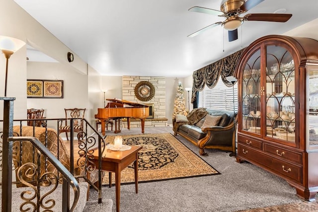 carpeted living room with ceiling fan