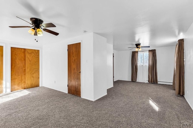 interior space with carpet, a ceiling fan, and a baseboard radiator