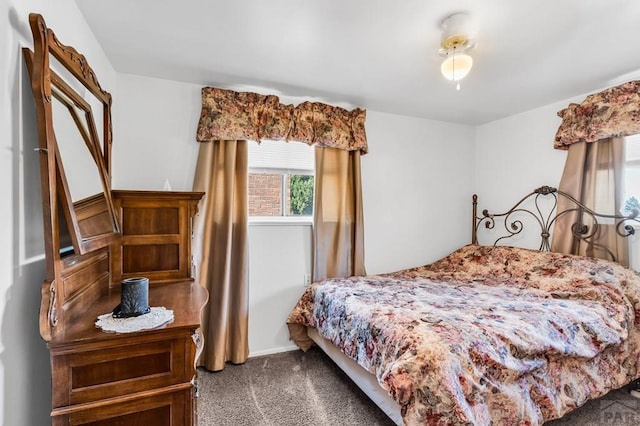 bedroom featuring carpet floors and baseboards