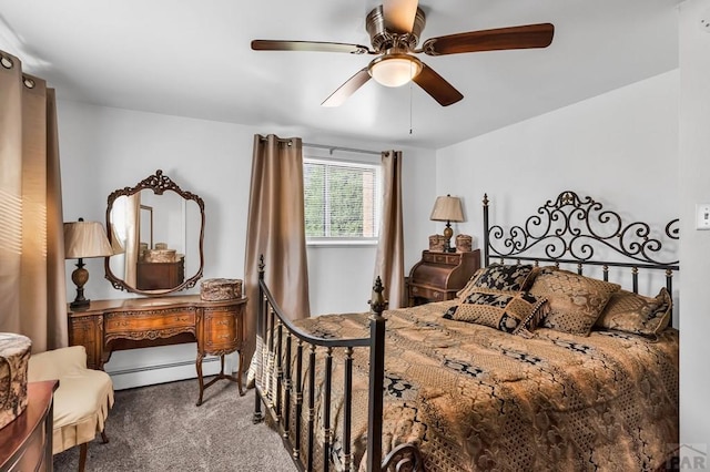 carpeted bedroom with baseboard heating and a ceiling fan
