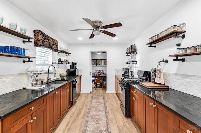 kitchen with open shelves, a sink, ceiling fan, black appliances, and light wood-type flooring