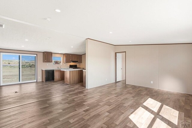 unfurnished living room featuring visible vents, recessed lighting, and wood finished floors