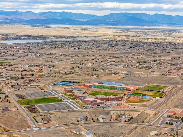birds eye view of property featuring a mountain view