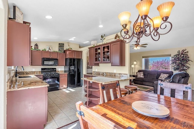 dining room with recessed lighting, lofted ceiling, ceiling fan with notable chandelier, and light tile patterned floors