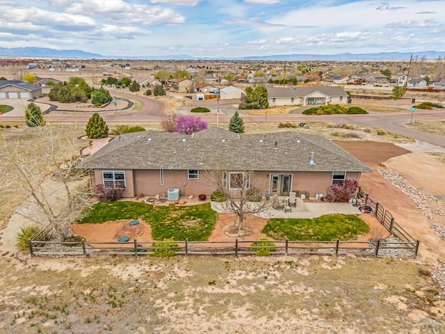 drone / aerial view featuring a mountain view and a residential view