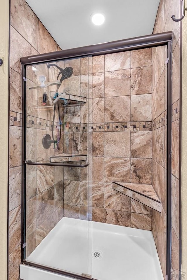 full bath featuring a shower stall