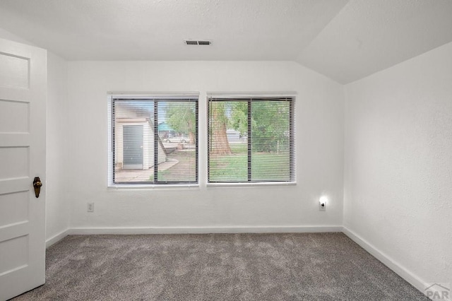 1638 Jackson St, Pueblo, CO 81004 - unfurnished room featuring carpet flooring, baseboards, and vaulted ceiling