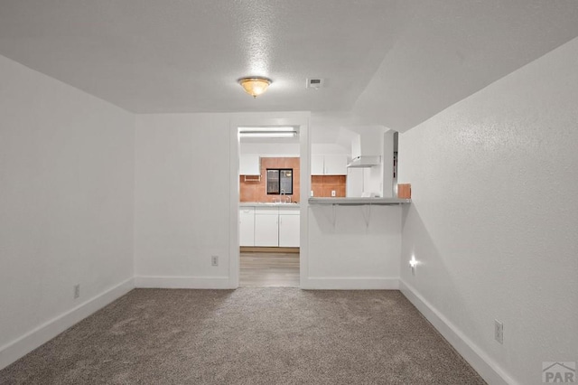 1638 Jackson St, Pueblo, CO 81004 - empty room featuring baseboards, carpet floors, and a sink