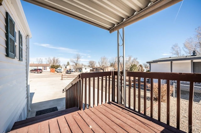 wooden terrace featuring a residential view