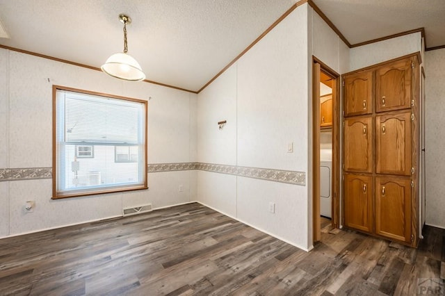 empty room featuring dark wood-style floors, a textured ceiling, visible vents, and crown molding