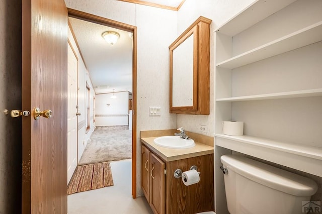 bathroom featuring vanity and toilet