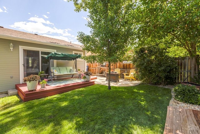 621 Twinflower Dr, Canon City, CO 81212 - fenced backyard with a deck and outdoor lounge area