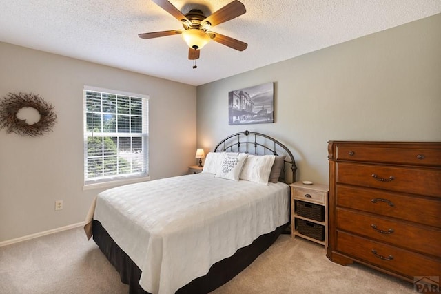 621 Twinflower Dr, Canon City, CO 81212 - bedroom featuring light colored carpet, a textured ceiling, and a ceiling fan