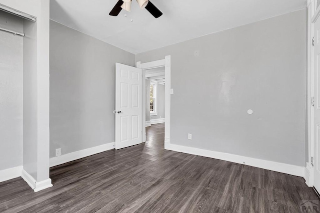 1111 Topaz Pl, Pueblo, CO 81004 - unfurnished bedroom with baseboards, dark wood-style floors, and ceiling fan