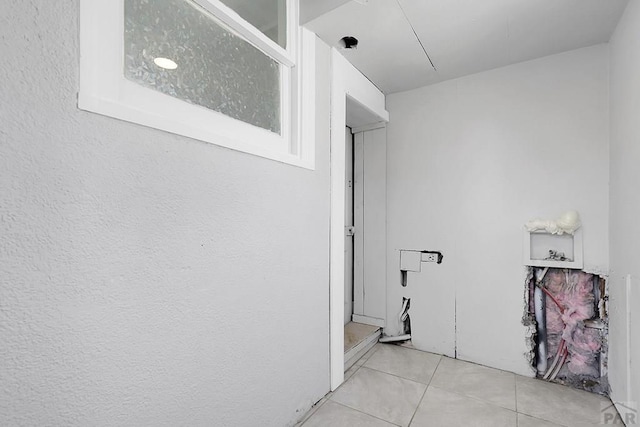1111 Topaz Pl, Pueblo, CO 81004 - laundry room with tile patterned floors and laundry area