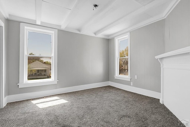 1111 Topaz Pl, Pueblo, CO 81004 - spare room with beamed ceiling, carpet flooring, and baseboards