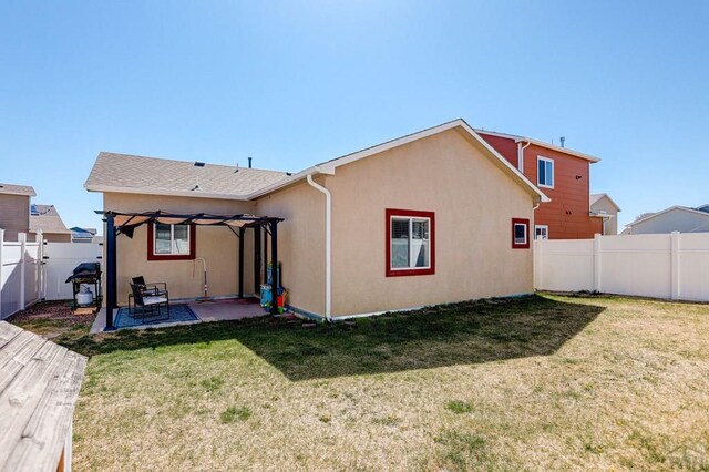 2025 Oneal Cir, Pueblo, CO 81004 - back of property with stucco siding and a patio