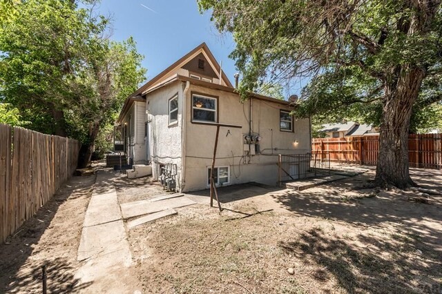 back of property featuring a patio, a fenced backyard, and stucco siding