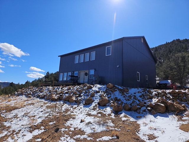 view of snow covered house