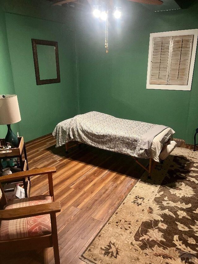 bedroom with wood finished floors