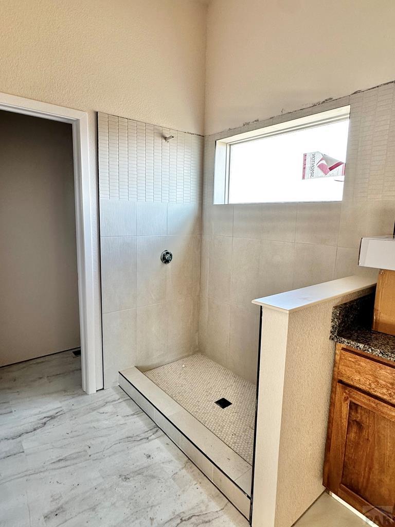 bathroom featuring a shower stall