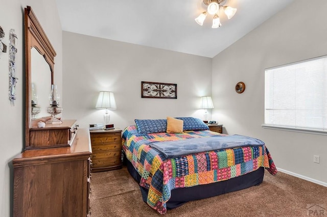 bedroom featuring carpet flooring, baseboards, and vaulted ceiling