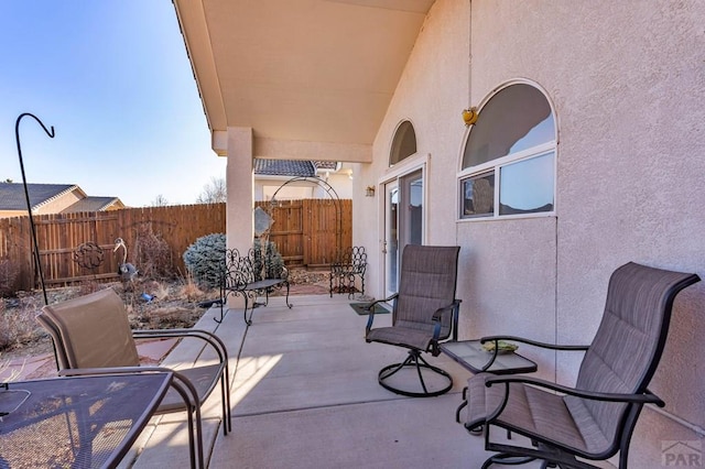 view of patio / terrace featuring fence