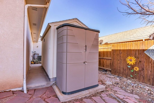 view of shed with fence