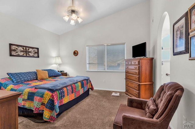 bedroom featuring vaulted ceiling, carpet flooring, and baseboards