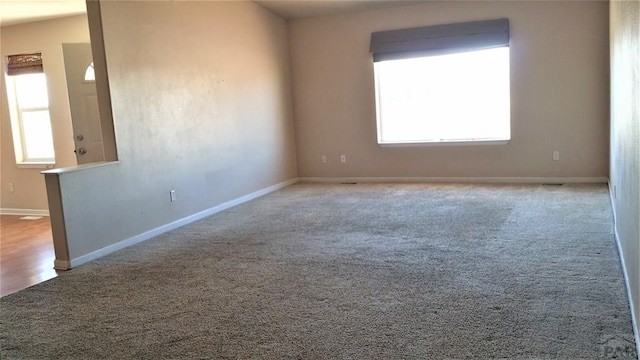 628 S Blakeland Ct, Pueblo West, CO 81007 - empty room featuring plenty of natural light, carpet flooring, and baseboards