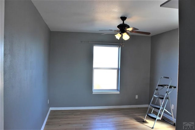 628 S Blakeland Ct, Pueblo West, CO 81007 - unfurnished room featuring healthy amount of natural light, a ceiling fan, and wood finished floors