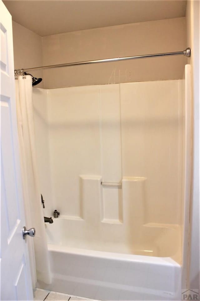 628 S Blakeland Ct, Pueblo West, CO 81007 - bathroom with shower / tub combo and tile patterned floors