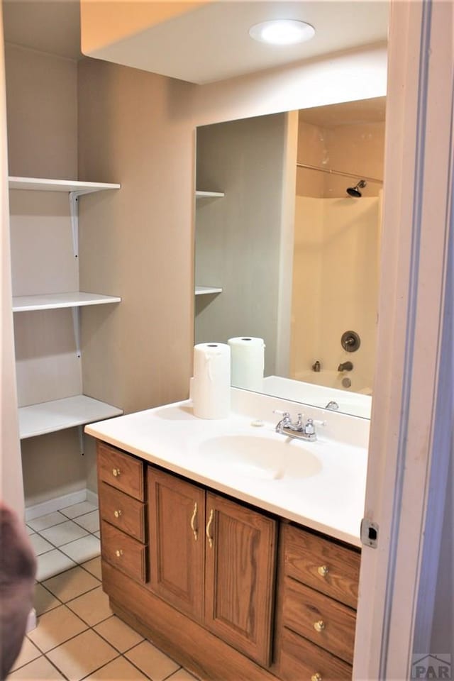 628 S Blakeland Ct, Pueblo West, CO 81007 - full bath featuring tile patterned floors, vanity, and shower / bathtub combination