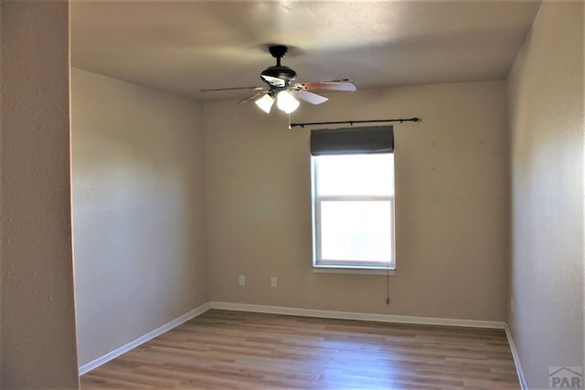 628 S Blakeland Ct, Pueblo West, CO 81007 - empty room with wood finished floors, ceiling fan, and baseboards
