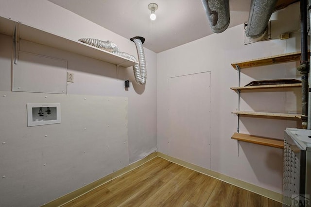 laundry room with hookup for a washing machine, laundry area, and wood finished floors