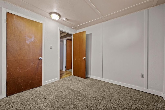 unfurnished room featuring carpet