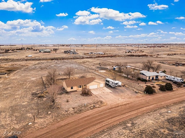 aerial view featuring view of desert and a rural view