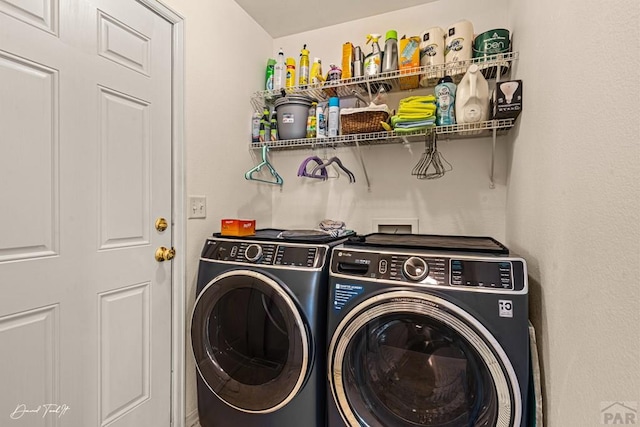 clothes washing area with laundry area and separate washer and dryer