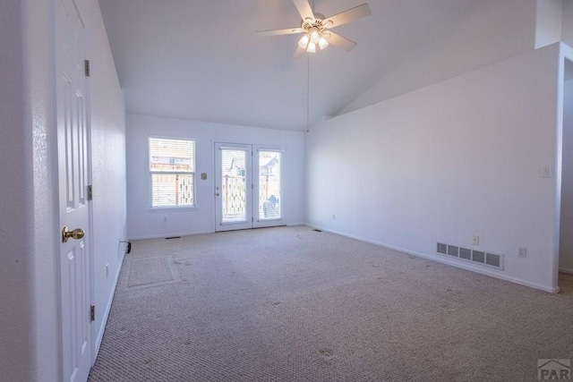 spare room featuring light carpet, baseboards, visible vents, a ceiling fan, and high vaulted ceiling