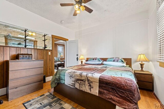 1802 E Routt Ave, Pueblo, CO 81004 - bedroom featuring a textured ceiling and wood finished floors