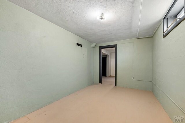 1802 E Routt Ave, Pueblo, CO 81004 - spare room with a textured ceiling