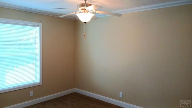 999 Fortino Blvd Unit 108, Pueblo, CO 81008 - unfurnished room with ornamental molding, a ceiling fan, and dark colored carpet